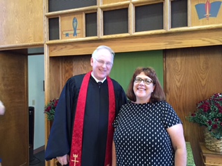 Pastor congratulated by Rev. Jane Anderson 